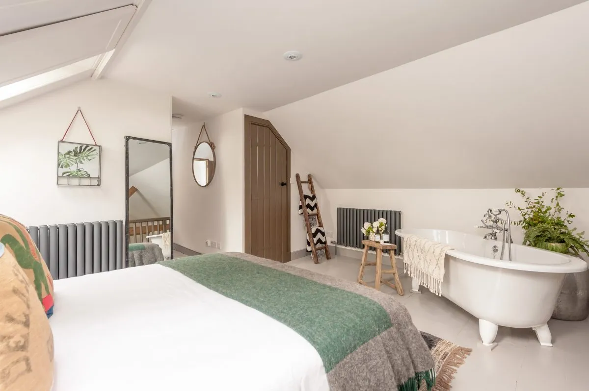 Mezzanine bedroom is the perfect hideaway with roll top bath
